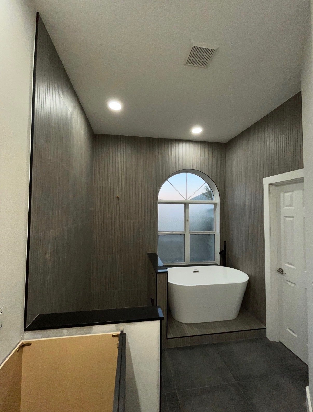 Fully remodeled bathroom with tile and freestanding tub